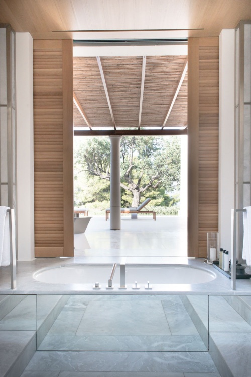 A luxurious bathtub with a view at Amanzoe, in the Peloponnese countryside, Greece